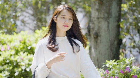 young asian woman walking outdoors