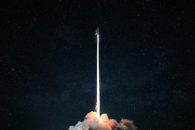 space rocket launch into the starry sky. space shuttle with blast and blast lift off into space on a dark background. successful start, concept