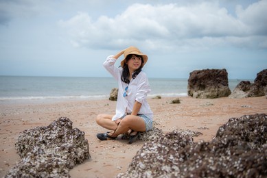 asian woman clear hat by the sea vegetable parchment tourism