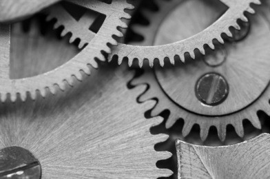 black white background with metal cogwheels a clockwork. macro