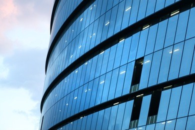 panoramic and perspective wide angle view to steel light blue background of glass high rise building skyscraper commercial modern city of future. business concept of successful industrial architecture