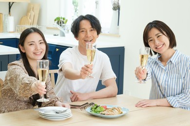 young asian people having a party in the kitchen