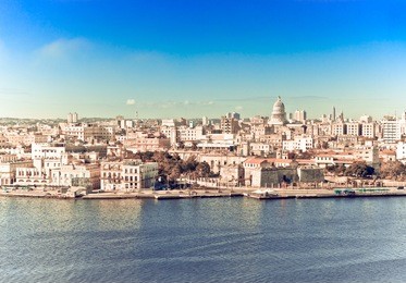 havana. view of the old city through a bay from morro's fortress,with a retro effect