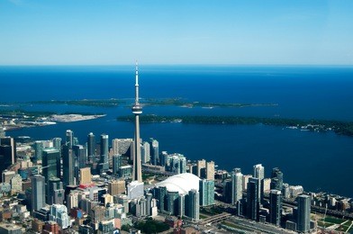 a view of a modern coastal city's downtown from above.