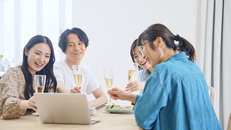 group of asian people doing an online party.
