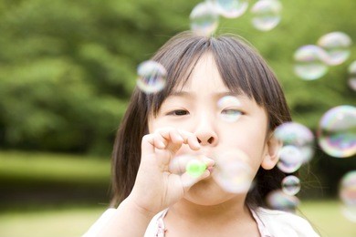 girl playing with the bubble