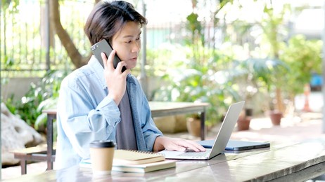 work from home, happy young asian man using mobile phone at home office, asia male smiling while using smartphone, people and technology, e commerce, online business, e learning, education