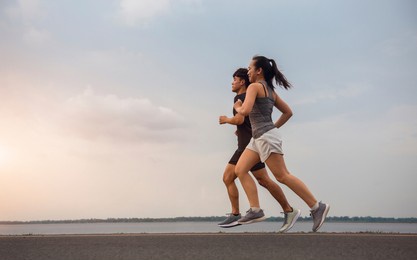 young couple running on the street be running for exercise. athletes running fitness to stay healthy. running and lifestyle concept.