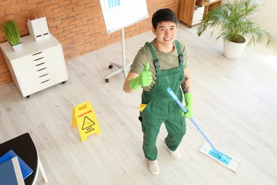 portrait of male asian janitor in office
