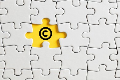 copyright icon on missing puzzle piece. property and intellectual rights protection.