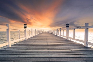 old wood bridge pier with nobody against beautiful dusky sky use for natural background ,backdrop and multipurpose sea scene
