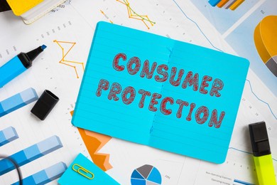 financial concept meaning consumer protection with inscription on the piece of paper. 
