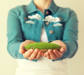 small fantastic island in women's hands.