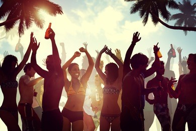 young people celebrating by the beach