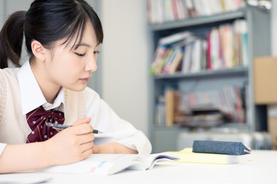 asian school girl studying in the room. cram school.