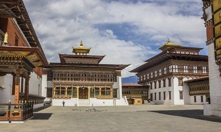 the dzong of thimpu, the capital of bhutan. dzongs are fortress like buildings which house a monastery and governmental office rooms.