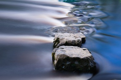 cool blue stepping stones in a river
