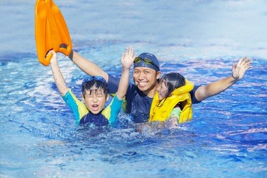 happy family on the swimming pool together