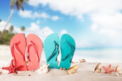 summer concept with colored sandals on beach