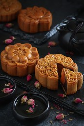cropped moon cake and black photo background