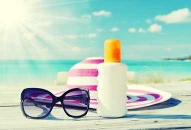 sun lotion and sunglasses