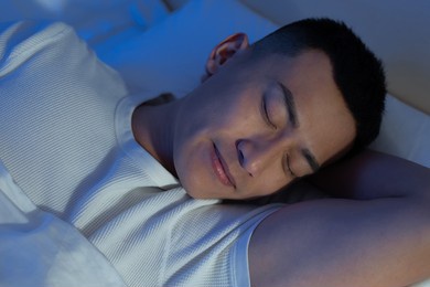 asian man sleep well with smile at night 