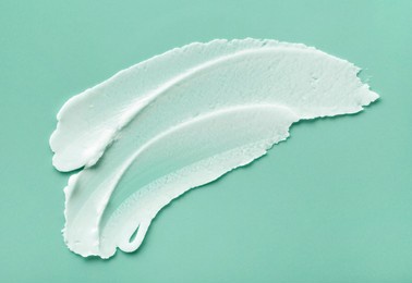 face or body cream hair balm cool green mint background