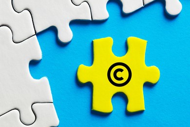 copyright icon on a puzzle piece. property and intellectual rights protection.