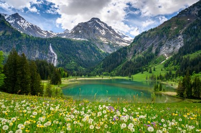 idyllic lake lauenensee with wildhorn in spring, bernese alps, switzerland