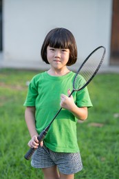 asian kid playing badminton, lovely girl