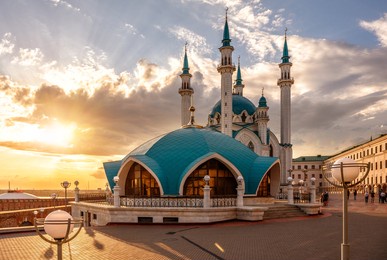 kazan kremlin at sunset, tatarstan, russia. sunny view of kul sharif mosque, great landmark of kazan. famous tourist attraction, islamic architecture in kazan city center. travel and tourism concept.