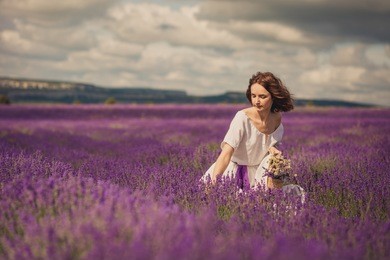 smiling beautiful brunette in the lavender field
