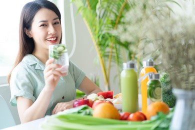 beautiful asian woman enjoying a plant-based meal

