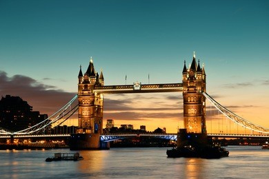tower bridge over thames river at dusk in london