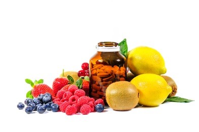 vitamin c and mix fruit on white background