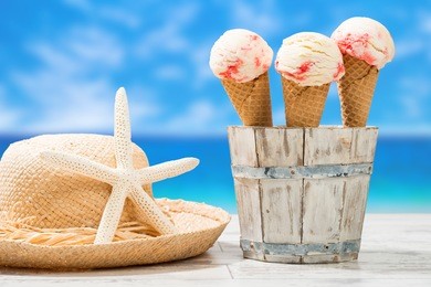 raspberry ripple ice creams with sunhat and beach blur back