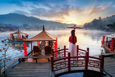 asian woman wearing chinese traditional dress at ban rak thai village in mae hong son province, thailand.