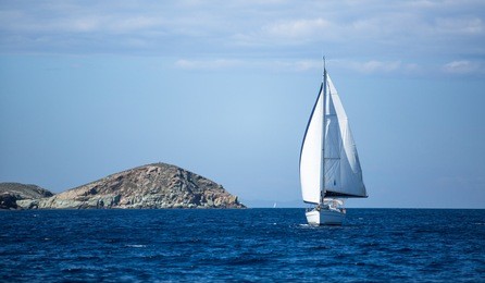 sailing ship yachts with white sails.