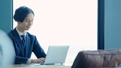 asian businessman using a laptop pc in the office.