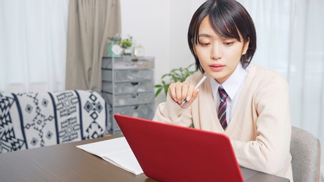 asian female student taking online class. e-learning. remote work.