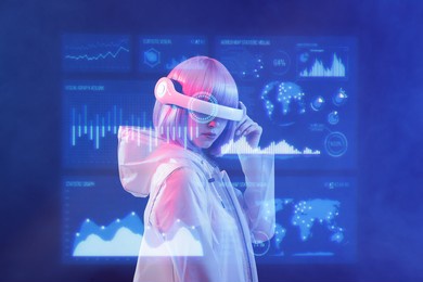 woman with futuristic tablet in hand. girl in glasses of virtual reality presses the start button. augmented reality game, future technology, ai concept. holographic interface to display data.