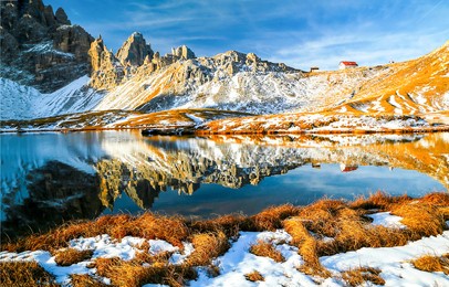 mountain lake in a snowy autumn