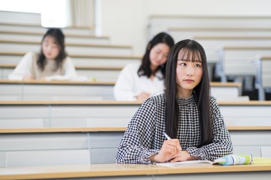 university students taking lectures in the lecture room