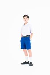 student wearing high school uniforms of thailand. boy wears a school uniform in an isolated background.