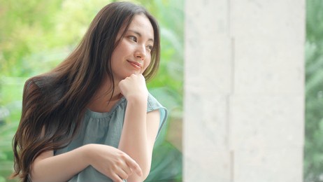 portrait of attractive asian woman wearing dress 