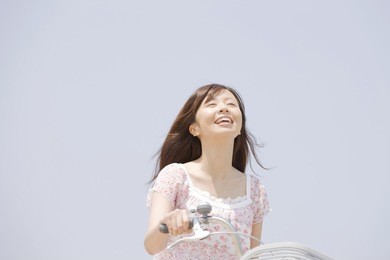 the woman riding a bicycle