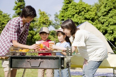 the family enjoying barbecue