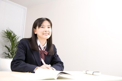 a middle school girl studying at school
