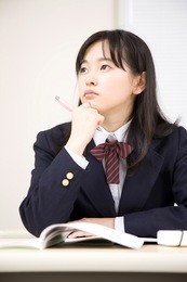 a middle school girl studying at school