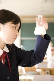 a middle school girl doing an experiment